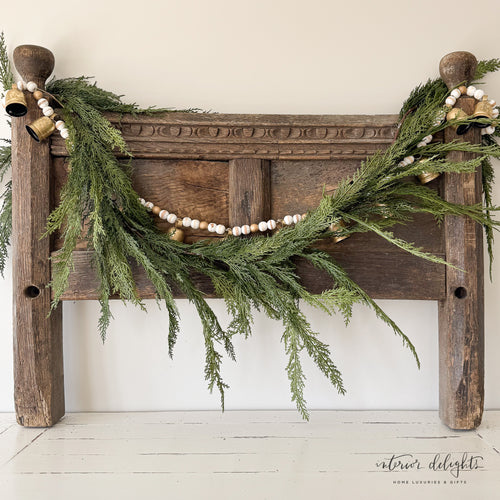 6ft Cedar Garland beautifully draped across a mantel, showcasing its realistic lifelike greenery, perfect for holiday decor.