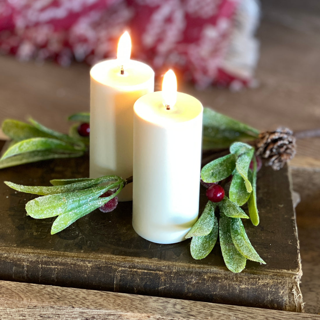 4&quot; tall Flameless Votives-Set of Two displayed with greenery, adding an elegant touch to any decor.