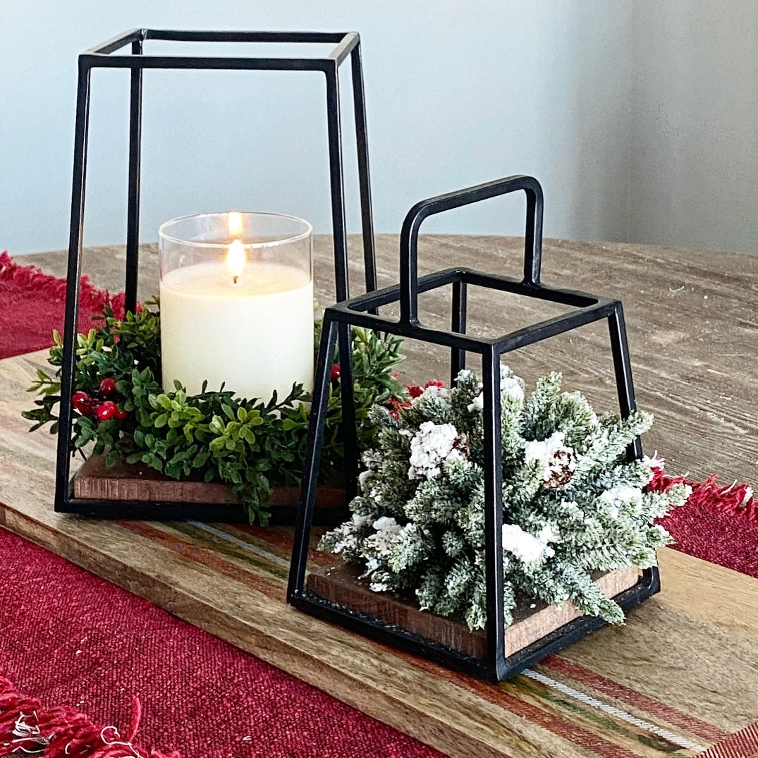 Mini Lantern Set showcasing a pair of charming black iron lanterns, perfect for accenting entry tables or bookshelves. The lanterns&