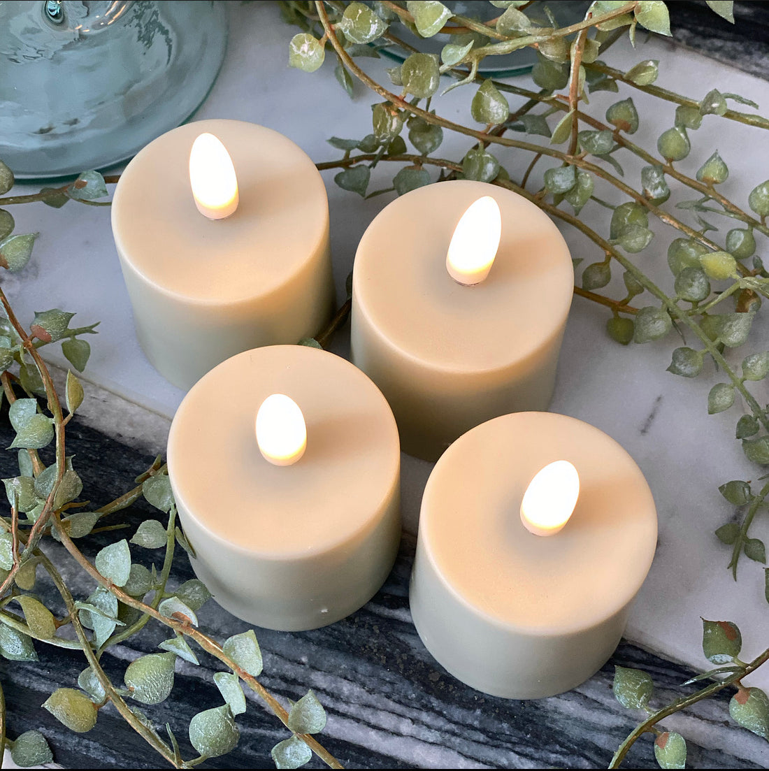 Rechargeable Flameless Votive Candle Set of 4 with remote control and up to 20 hours of illuminating warmth.